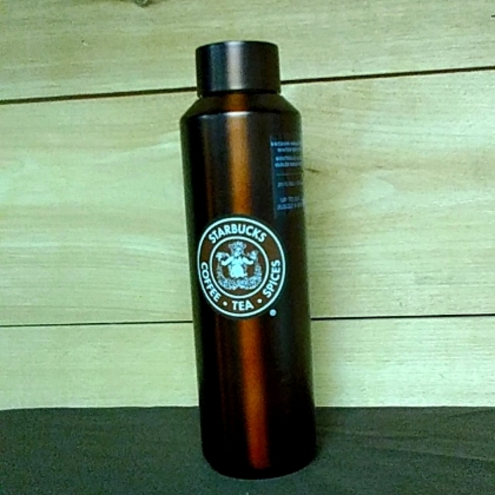Starbucks drink thermos/metal mug,/water bottle.